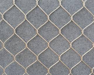 Stainless steel inter-woven cable mesh on the floor.