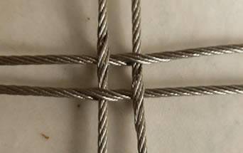 A square cable mesh in normal woven style is placed on the floor.