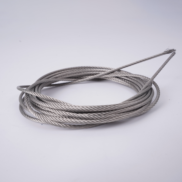 Bundle of stainless steel cable on a gray background